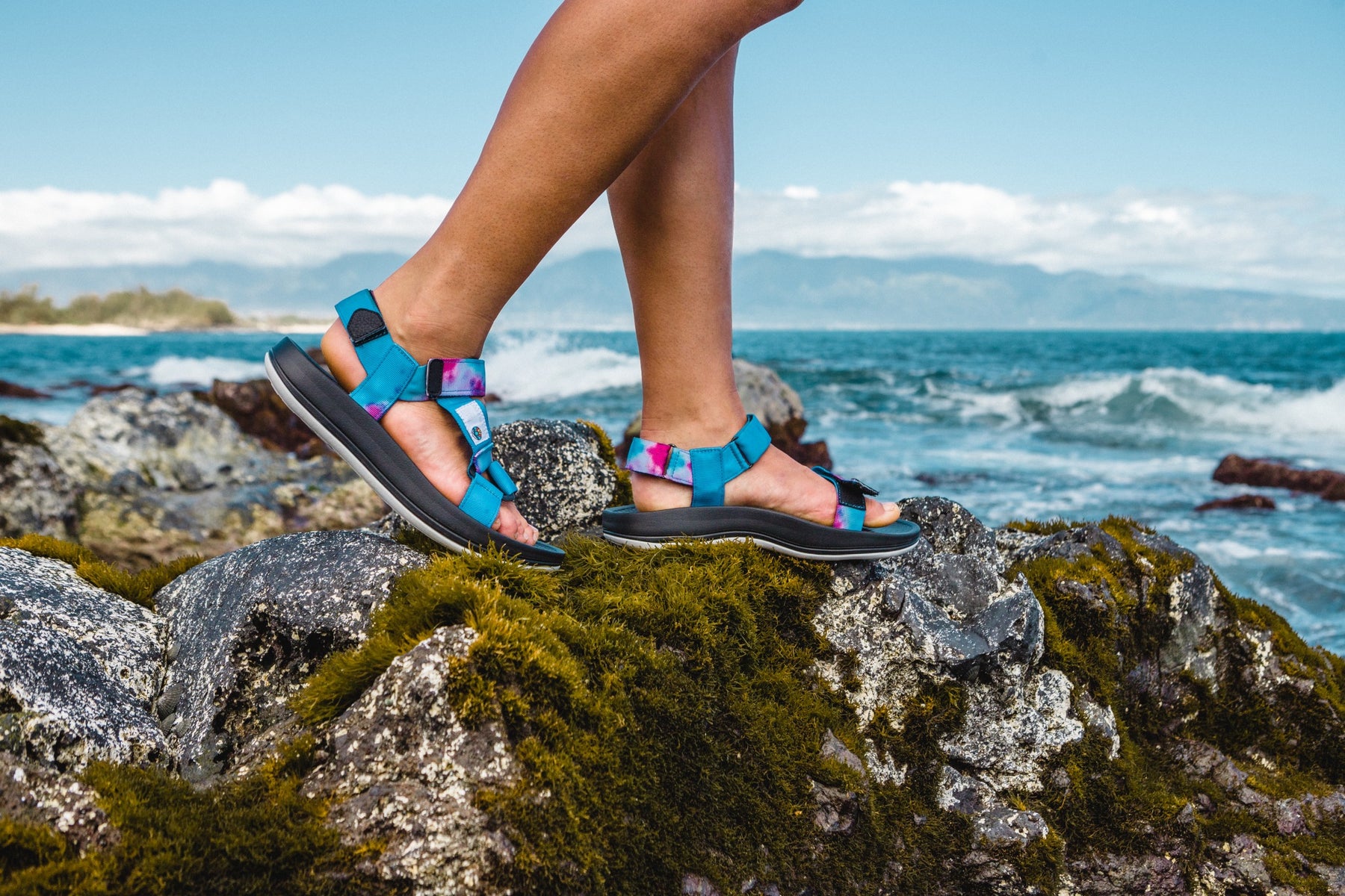 photo of a woman wearing sandals at the ocean, eco-friendly sandals, shoes, and slippers, Freewaters